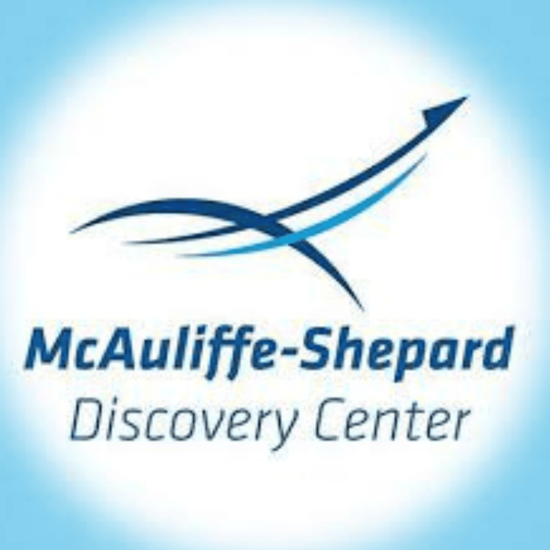 Logo for the McAuliffe-Shepard Discovery Center featuring two blue swooshes forming an upward arrow, with the centers name written below in blue text on a white and blue gradient background.