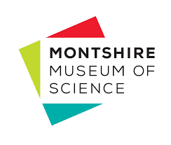 Logo for the Montshire Museum of Science featuring the museum’s name in black text surrounded by three colorful geometric shapes: green on the left, red on top, and blue on the bottom right.